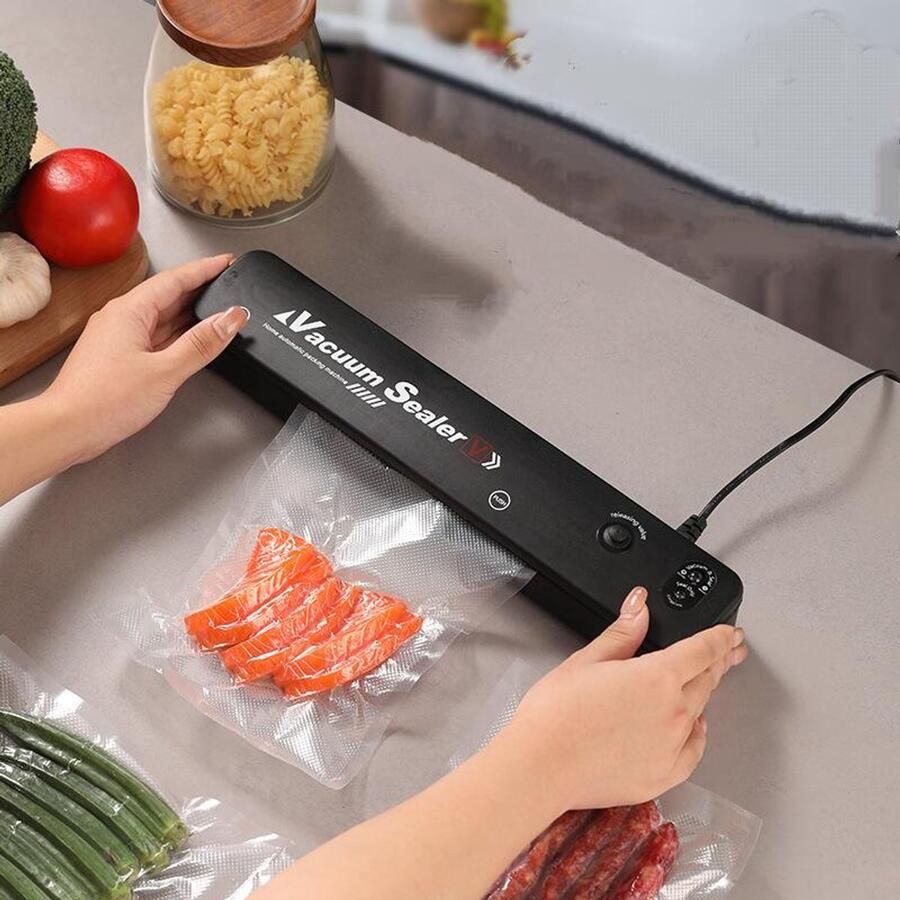 Vacumeermachine Vacuümverpakkingsmachine– Compact ontwerp -Automatische werking Uiterst stil en snel (verpakking in 15 seconden) Inclusief 30vacuümzakken – Zwart vacuümsysteem voor alle soorten voedsel